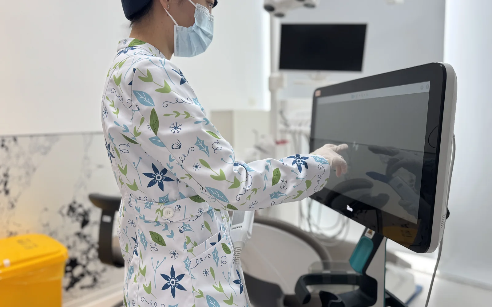 A dental clinician using digital scanning equipment at Arrail Dental in China